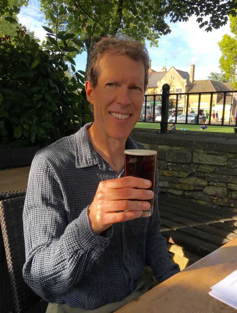 Ken just loved the regionally brewed beer at the waterside Kingsbridge Pub. ©Laurel Kallenbach