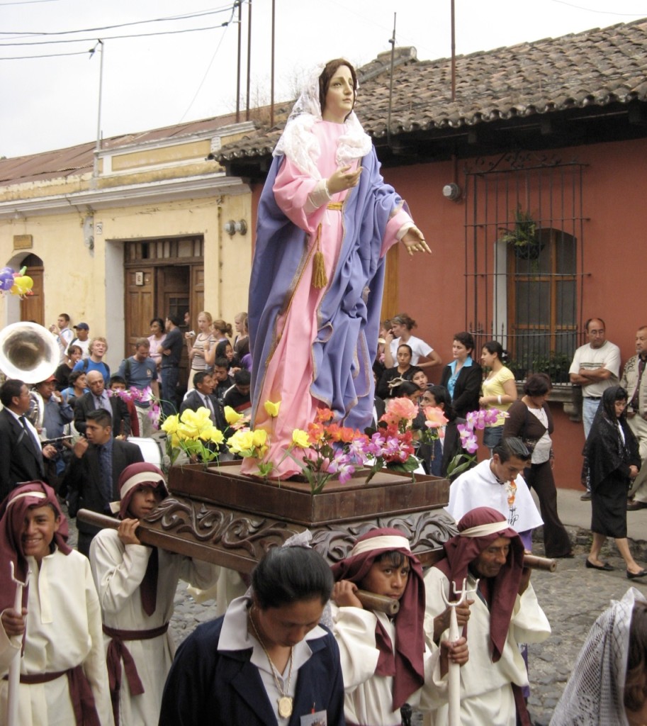 This small float is probably Mary Magdalene. The sousaphone behind her is another band of musicians. ©Laurel Kallenbach