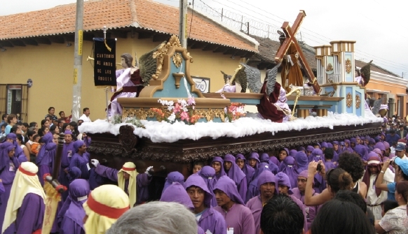 It must be quite an honor to take the center position at the head of the float. That man or woman carries the float with their arms spread wide in a position reminiscent of a crucifixion. ©Laurel Kallenbach