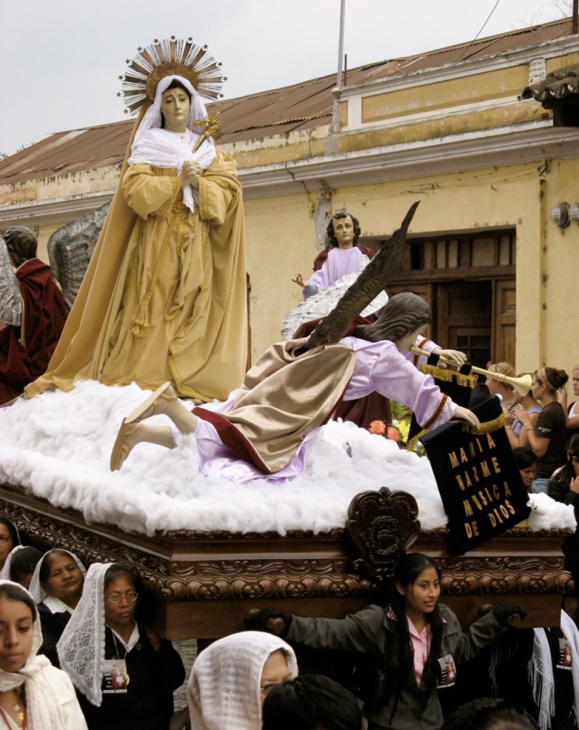 Mary, the Queen of Heaven looks mournfully down upon the spectators while women shoulder the burden of her holiness. ©Laurel Kallenbach