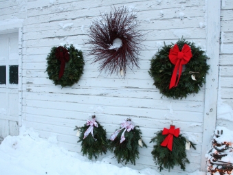 Wreaths on garage Wreaths for sale in the town of Egg Harbor were displayed on a historic garage.