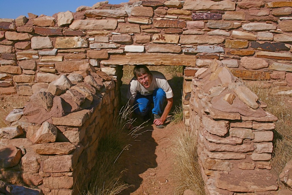 Ken explores some of the passages at the ruin of Lowry Pueblo. © Laurel Kallenbach