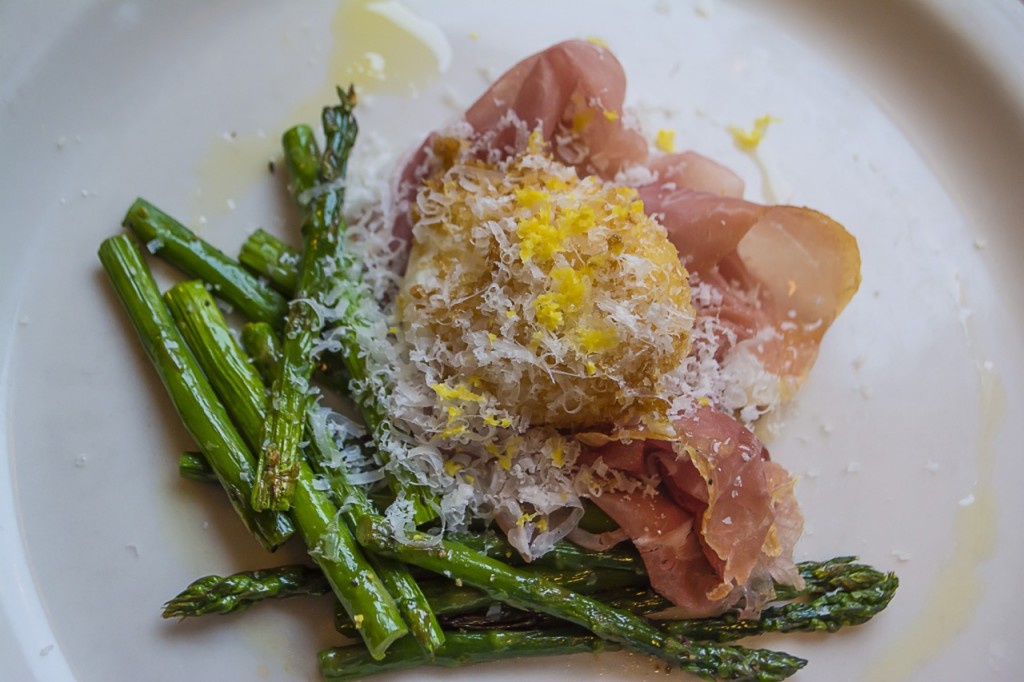 Awesome appetizer: asparagus with poached egg and prosciutto. ©Allie Stoudt