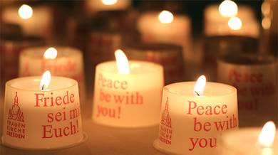 Visitors light candles for peace inside the Frauenkirche sanctuary. Photo courtesy Frauenkirche Dresden