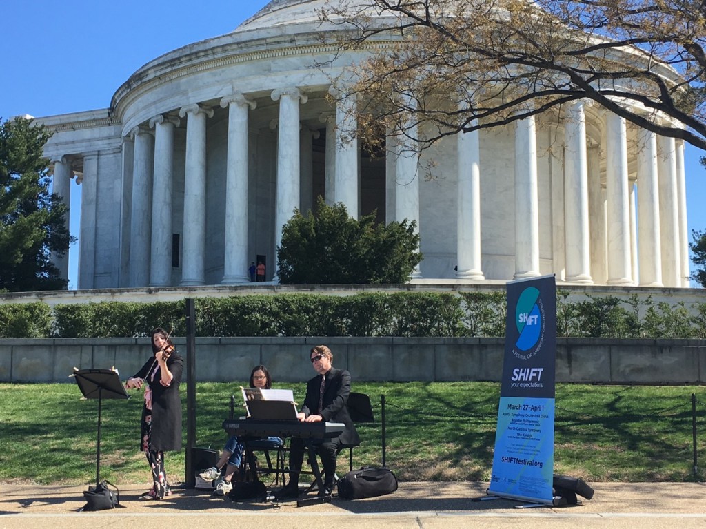 Violinist Jennifer Carsillo and Michael Gutterman (the Boulder Phil conductor) perform beside the Jefferson Monument. ©Ken Aikin