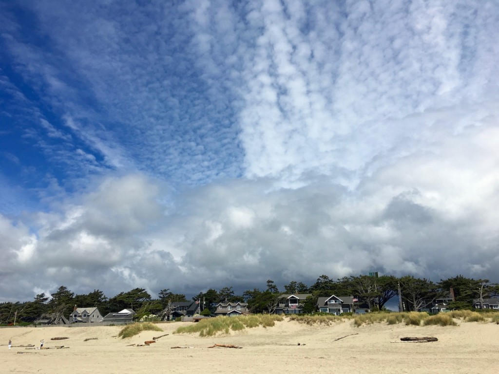 Elegant beachfront houses pale by comparison to the grandeur of the sky. ©Laurel Kallenbach