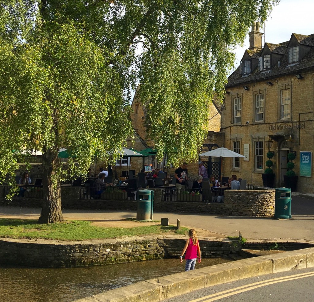 The banks of the River Windrush are lined with restaurants in Bourton-on-the-Water. ©Laurel Kallenbach