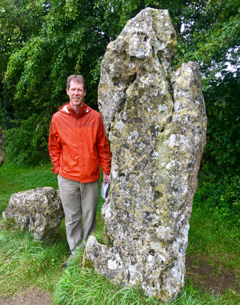 Ken beside one of the tallest stones in the King's Men circle ©Laurel Kallenbach
